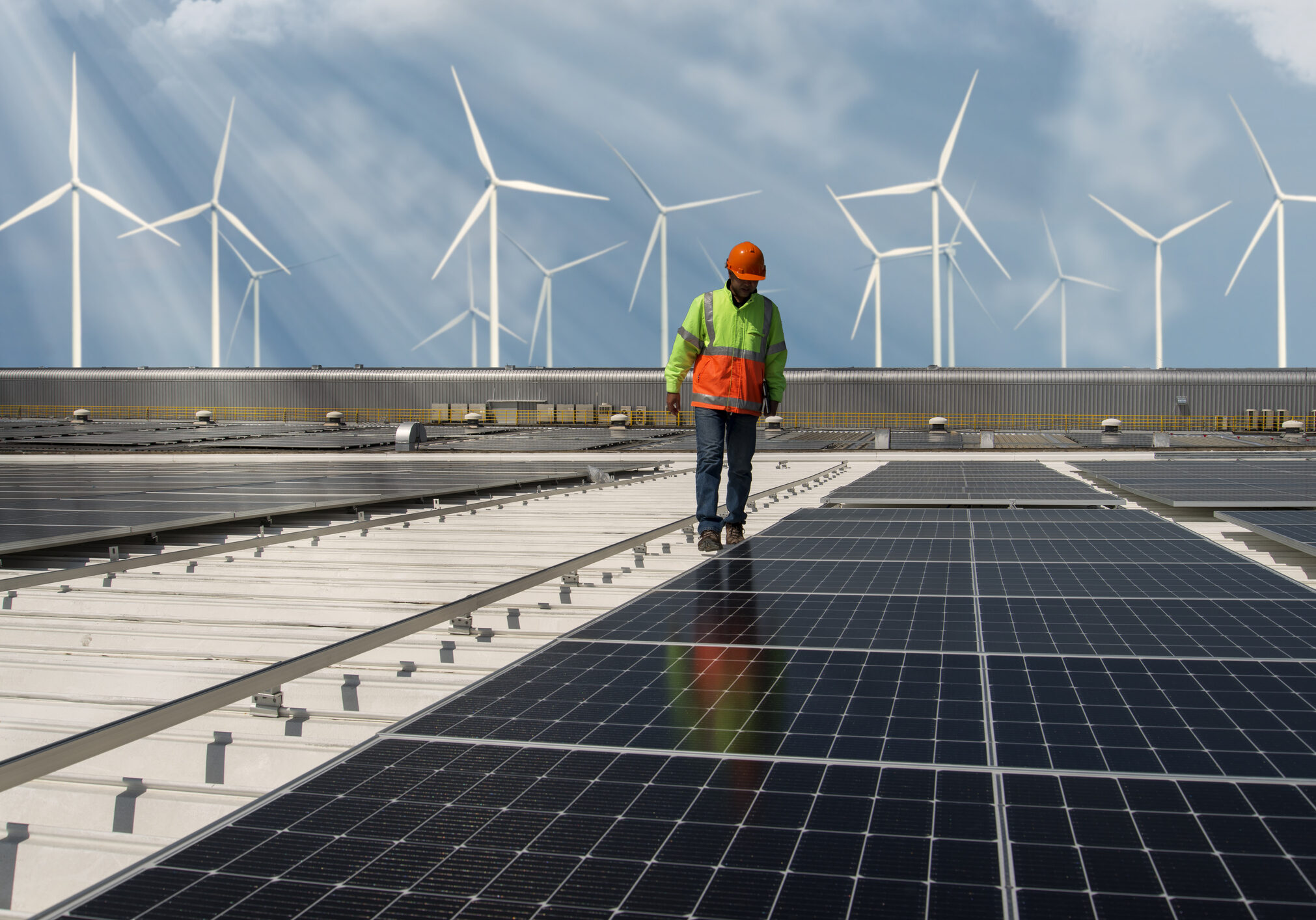 Inspector Engineer Man Holding Digital Tablet Working in Solar Panels Power Farm, Photovoltaic Cell Park, Green Energy Concept.